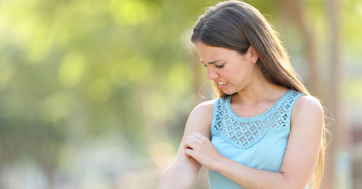 Woman Itching Arm